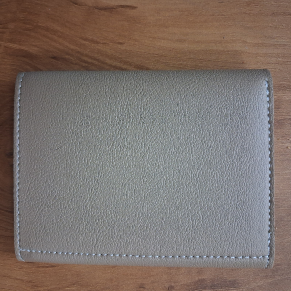 Back view of Elion beige vegan leather envelope wallet for women showing clean reverse side